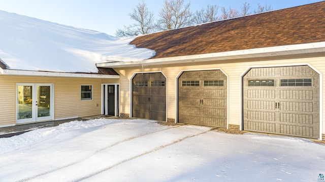 view of snow covered garage