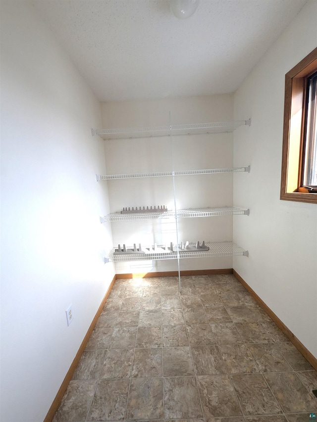 empty room with baseboards