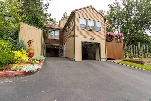 view of front of property with driveway, an attached garage, and stucco siding