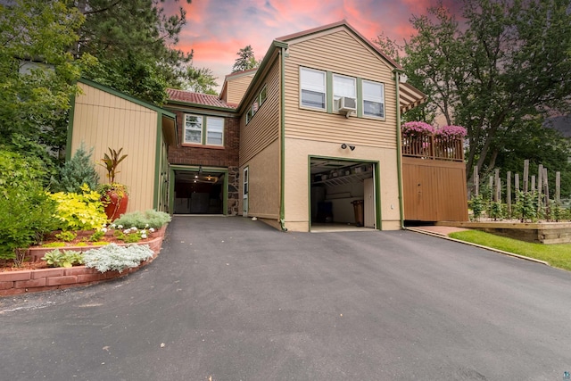 view of front of property featuring a garage, driveway, and stucco siding