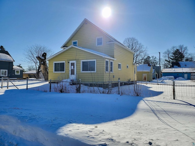 view of front of house with fence