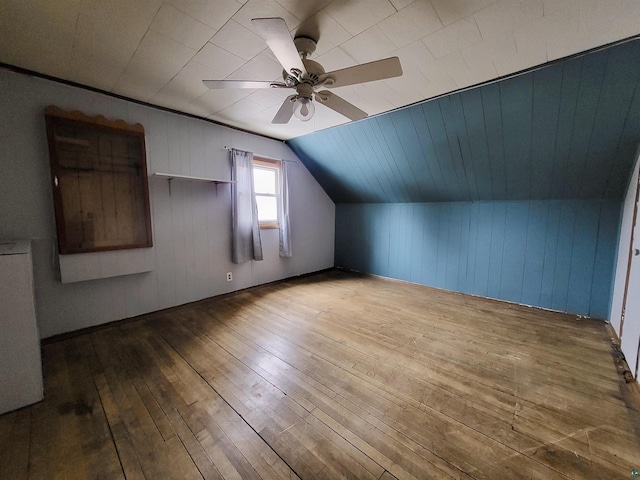 bonus room featuring lofted ceiling, wood-type flooring, and a ceiling fan