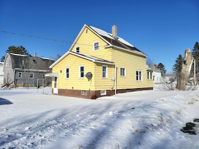 view of snow covered property