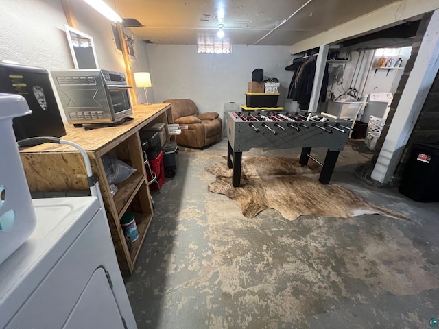 recreation room with washer / dryer and concrete floors