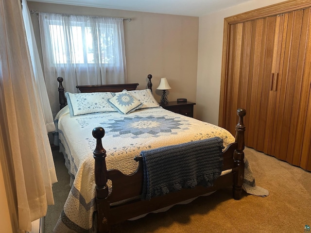 bedroom featuring light colored carpet