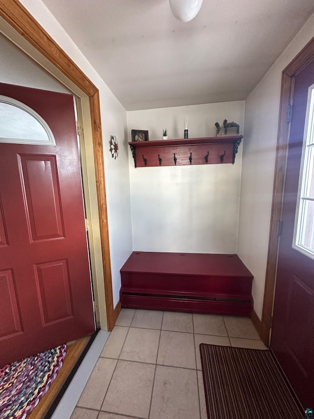 mudroom featuring light tile patterned floors and baseboards