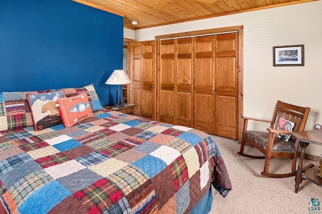 bedroom with a closet, light carpet, wood ceiling, and ornamental molding