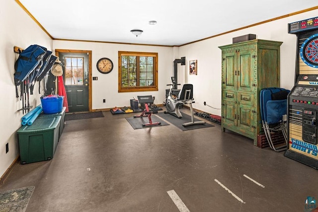 workout room featuring baseboards and ornamental molding