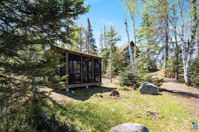 view of yard with a sunroom