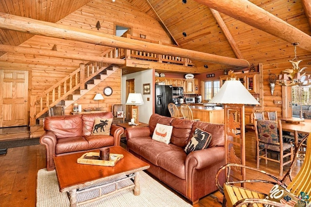 living room featuring an inviting chandelier, hardwood / wood-style flooring, stairway, and wood ceiling