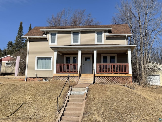 view of front of property with stairway and covered porch