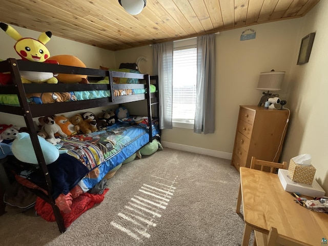 bedroom with wooden ceiling, carpet, and baseboards