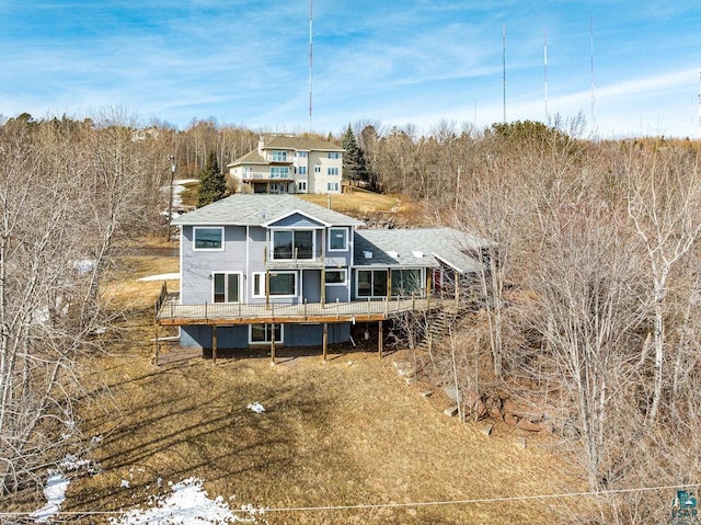 rear view of property with a wooden deck