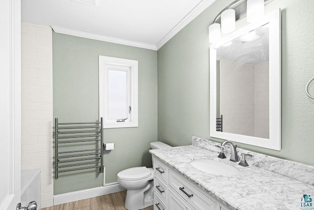 full bath with vanity, wood finished floors, baseboards, crown molding, and toilet