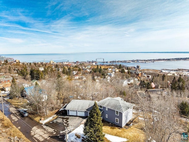 birds eye view of property with a water view