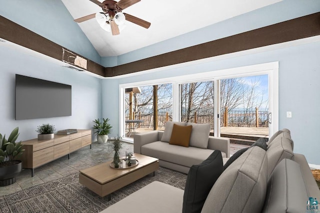 living area featuring a wealth of natural light, ceiling fan, and vaulted ceiling