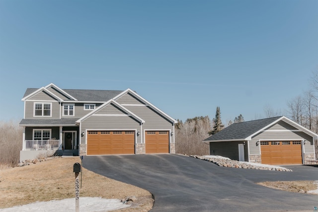 craftsman house with stone siding and covered porch