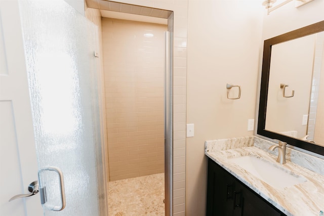 full bath featuring a shower stall and vanity