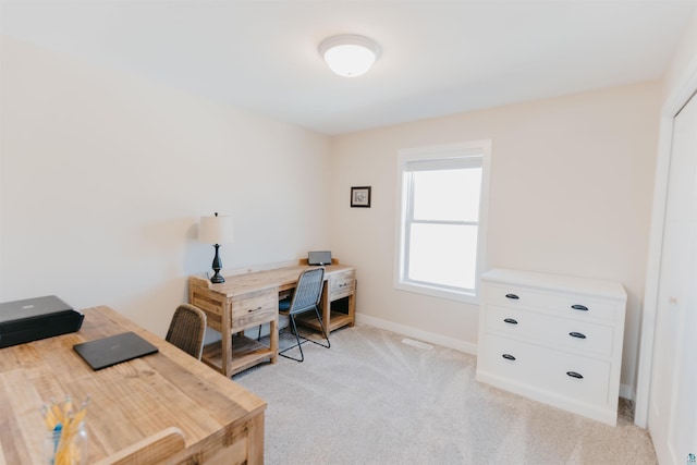 office with light colored carpet and baseboards