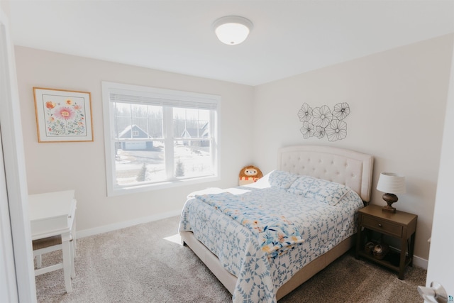 carpeted bedroom with baseboards