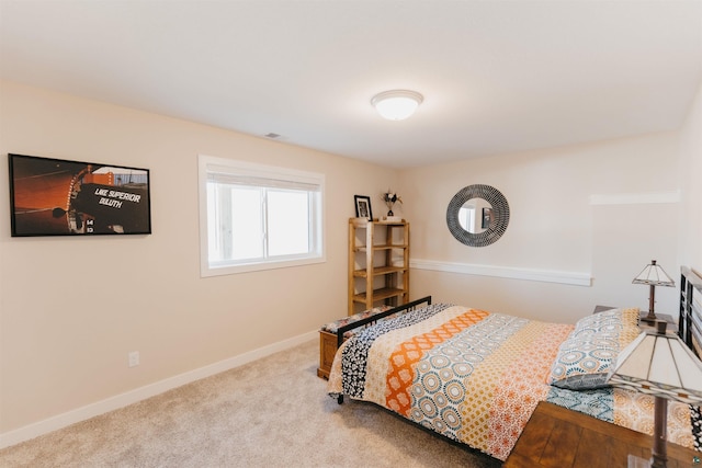 bedroom featuring carpet flooring and baseboards