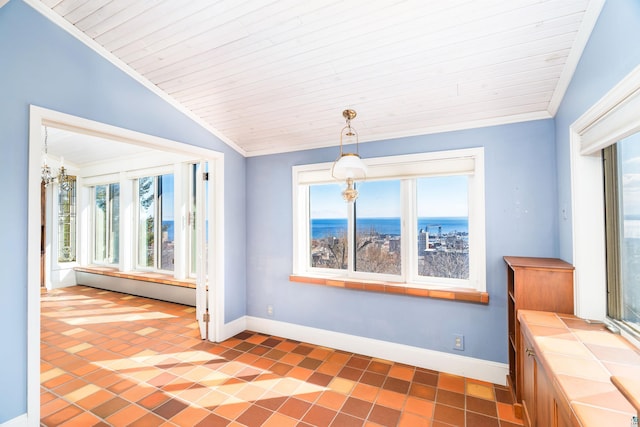 interior space featuring plenty of natural light, lofted ceiling, and ornamental molding