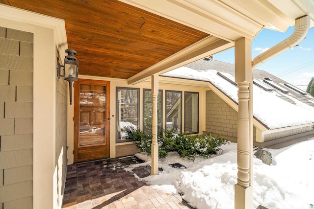 view of snow covered property entrance