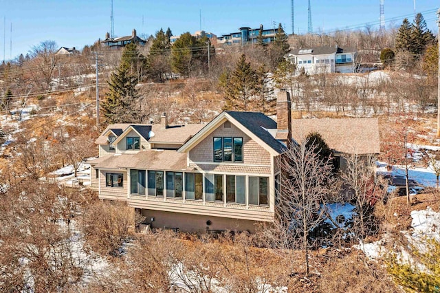 back of property featuring a chimney