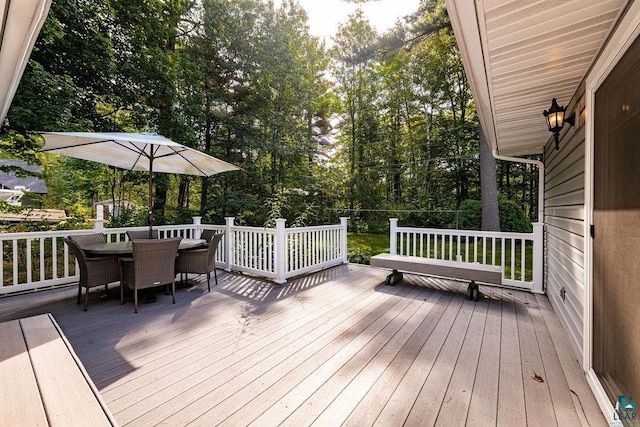 wooden deck with outdoor dining space