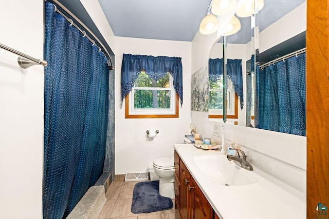 bathroom with visible vents, baseboards, toilet, a shower with shower curtain, and vanity