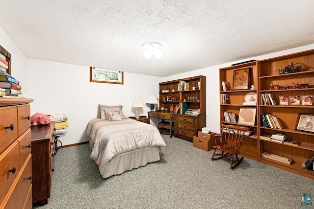 bedroom with baseboards, a textured ceiling, and carpet