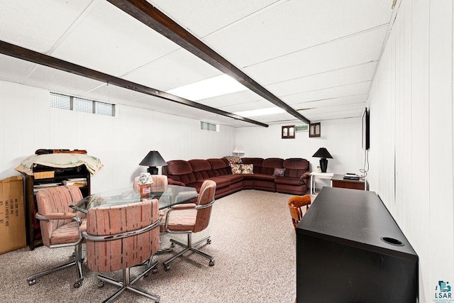 living room featuring visible vents and beamed ceiling