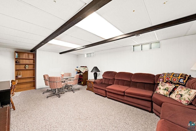 living area featuring beamed ceiling, carpet flooring, and visible vents