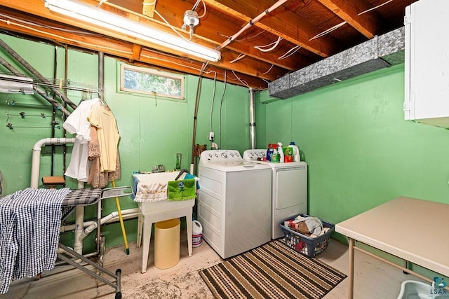 clothes washing area with laundry area and washing machine and clothes dryer