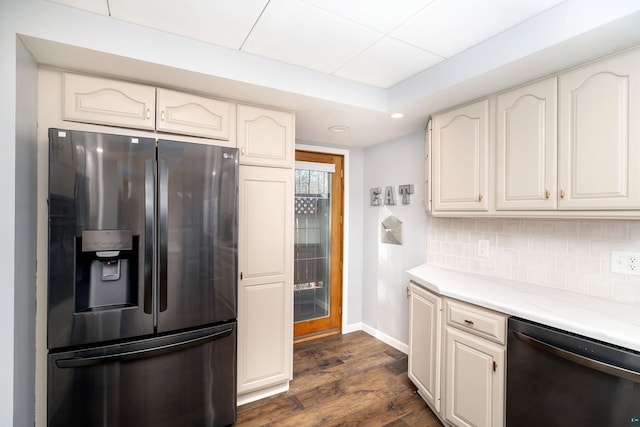 kitchen featuring baseboards, light countertops, decorative backsplash, appliances with stainless steel finishes, and dark wood-style floors