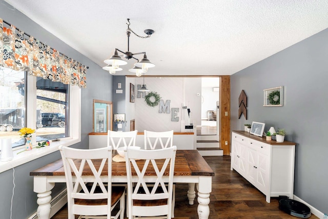 dining space with dark wood-type flooring, baseboards, a chandelier, stairway, and a textured ceiling