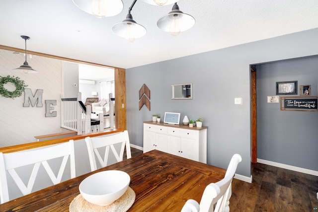 dining area with wood finished floors and baseboards