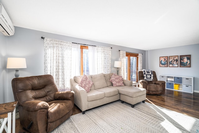 living area featuring light wood-type flooring and an AC wall unit