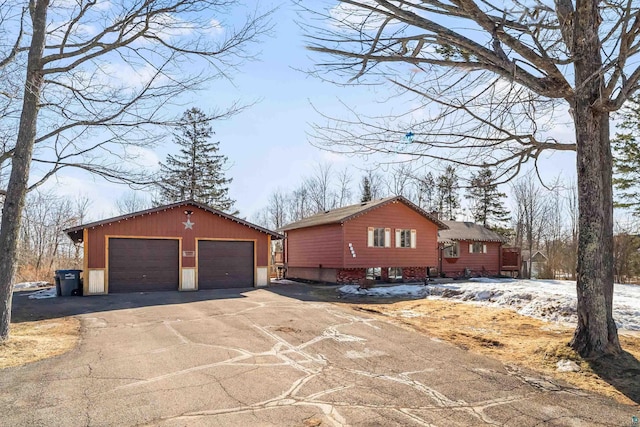 view of front of property with an outbuilding and a garage