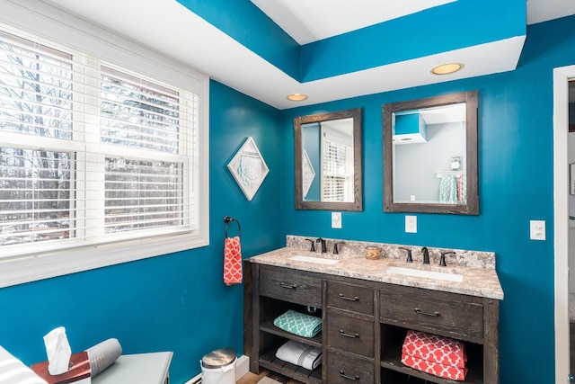 bathroom with double vanity and a sink