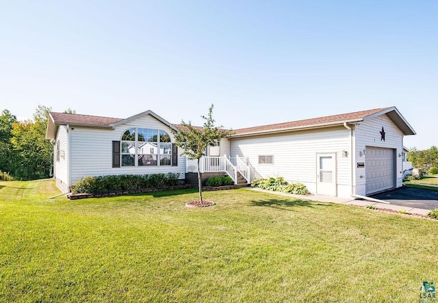 single story home featuring driveway, an attached garage, and a front lawn