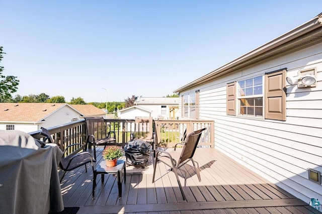 wooden deck featuring area for grilling