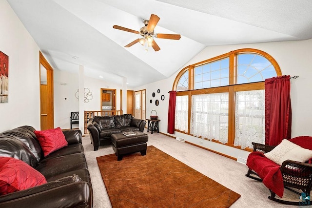 carpeted living room featuring lofted ceiling, baseboards, and ceiling fan