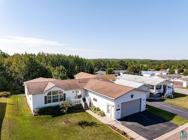 drone / aerial view with a view of trees