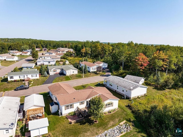 bird's eye view with a residential view and a wooded view