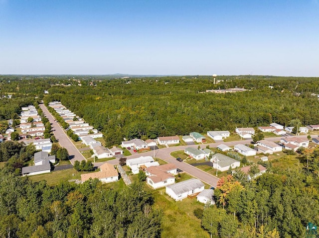 bird's eye view featuring a view of trees and a residential view