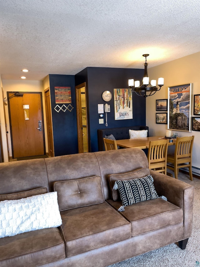 living room featuring recessed lighting, a textured ceiling, an inviting chandelier, and carpet