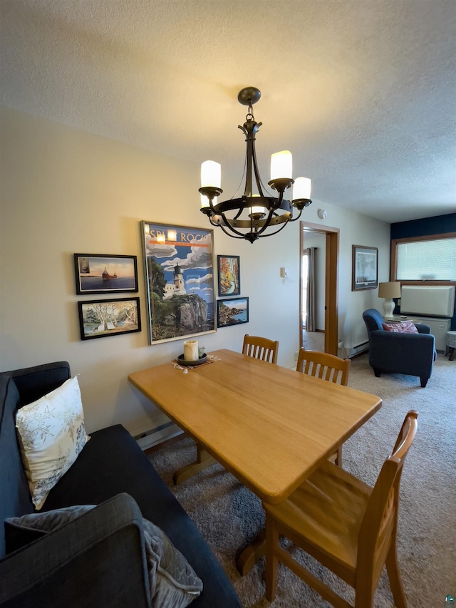 carpeted dining room with a baseboard heating unit, a notable chandelier, and a textured ceiling