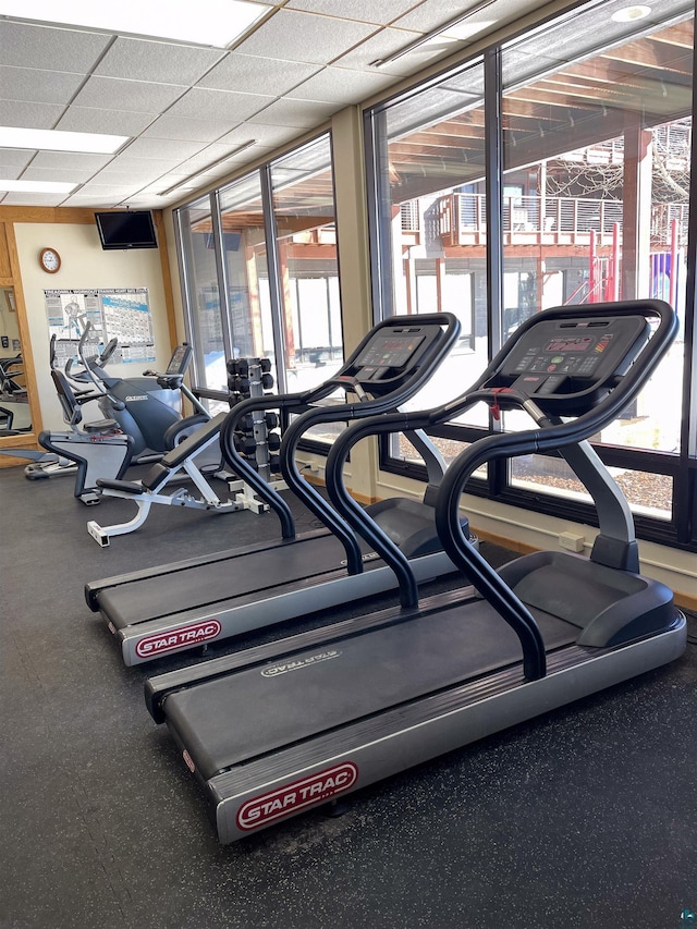 exercise room with floor to ceiling windows