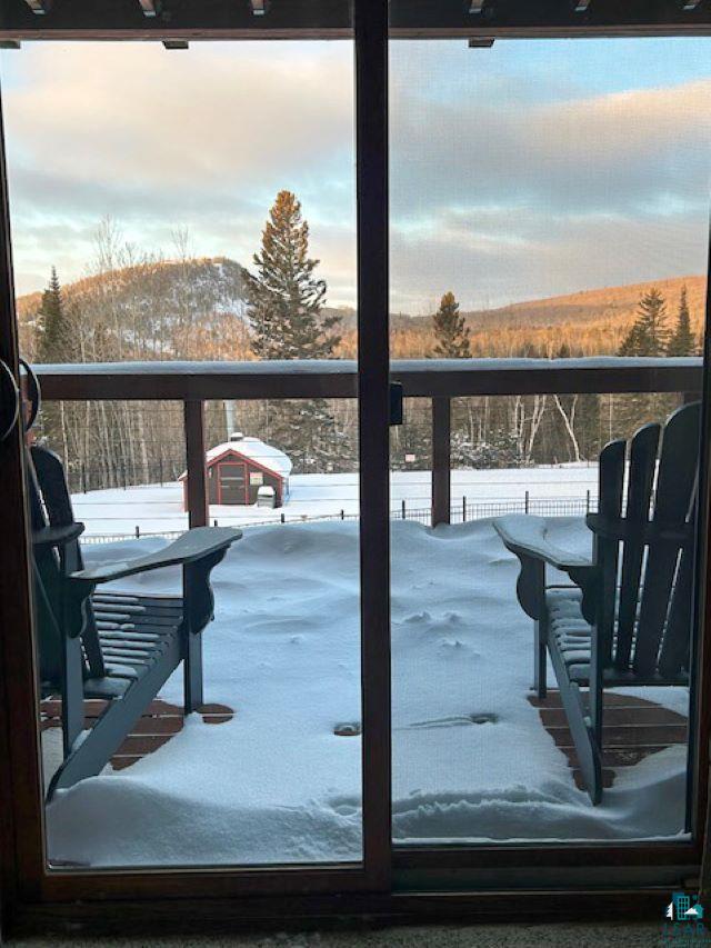 view of snow covered deck